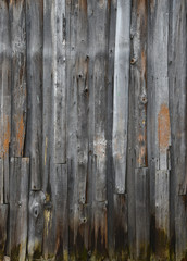 Old boards, a wooden peeled wall of brown color