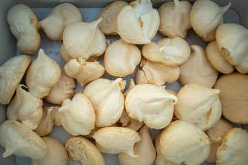 freshly baked meringue in a cookie tin