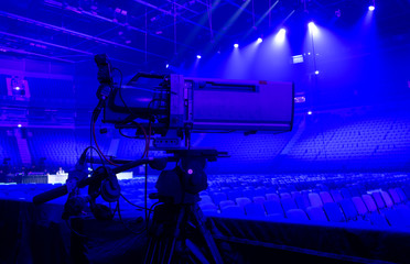 tv camera in a concert hall. Digital TV camera.