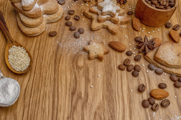 Background with homemade cakes, fragrant cookies. Cookies in the form of hearts, stars, coffee beans, spices, almonds.