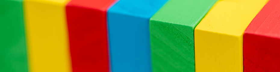 wooden toy blocks stack game using as background business or education cover page concept.