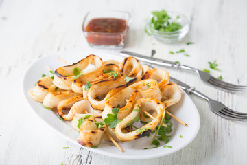 Grilled squid rings on a skewer