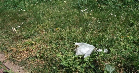 Discarded single use plastic glove thrown on the floor during global pandemic