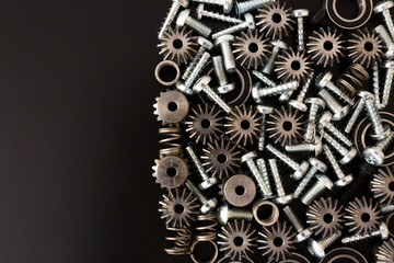 Mechanical components on black background. Industrial objects
