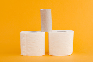 Toilet paper roll on a yellow background.