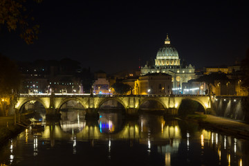 Fototapeta premium Night scene of Rome, Tevere river with basilica in background