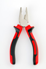 The pliers are red and black on a white background