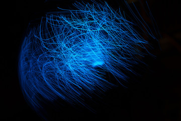 Blue abstract particles and lines with bokeh and blur in dark background