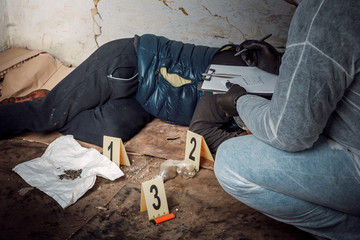 An expert is gathering evidence at a crime scene. The law and the concept of police forensics.