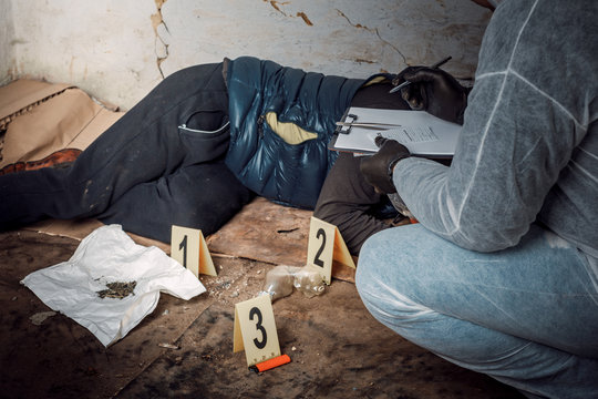 An Expert Is Gathering Evidence At A Crime Scene. The Law And The Concept Of Police Forensics.