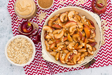 Baked sweet cinnamon apples with oatmeal flakes. Vegan healthy breakfast