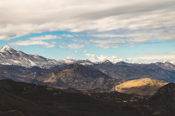 Mountain Landscape with Snow and Clouds