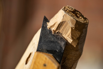 Sharp carving knife carves wood 
