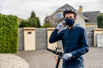 talking on the phone in a mask - life in quarantine - an outbreak of the COVID-19 coronavirus © WATCH_MEDIA_HOUSE