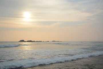 Fototapeta premium Hikkaduwa, Sri Lanka - March 11, 2019: View from Hikkaduwa Beach to Indian ocean during the sunset