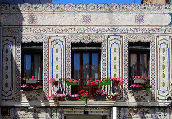 Facade with colorful mosaics in Cabanyal Quarter in the city of Valencia. Spain.