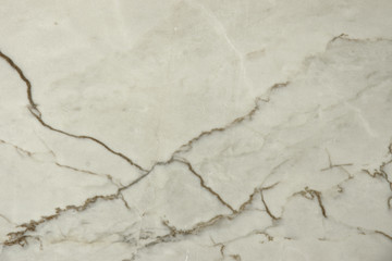 The background is made of natural white stone with dark veins called marble Bianco Portugalo