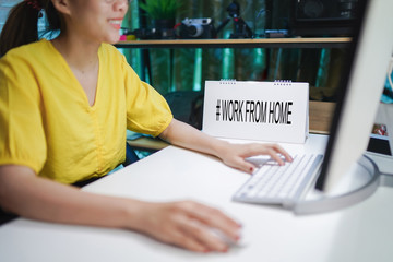 Smiling business woman working with laptop on table. Concept Work from home, prevention COVID-19.