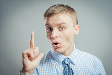 Eureka. man with an idea raising his finger in the air
