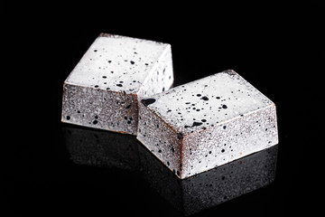 Hand made chocolate candy. Milk chocolate with crazy flavours. Black background