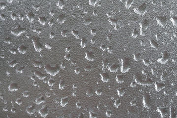 Water droplets on a glass. Background image of wet glass.