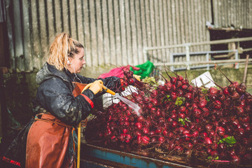 Female Farmer washing her beetroot crop