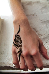 temporary henna tatto on woman hand