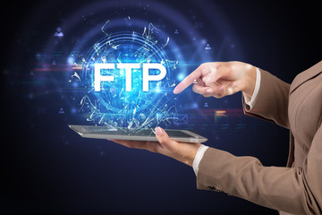 Close-up of a touchscreen with FTP abbreviation, modern technology concept