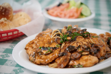Italian pasta with chicken meal garlic rolls and salad