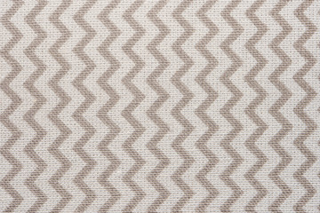 Pattern of gray and white striped zig zag. Macro textile texture
