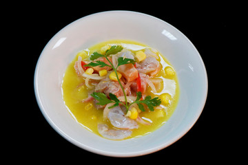 peruvian seafood ceviche in a bowl with black ground