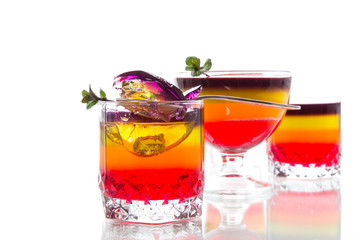 Sweet multi-colored fruit puff jelly in a glass cup