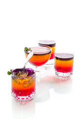 Sweet multi-colored fruit puff jelly in a glass cup