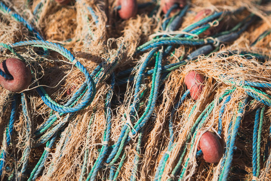 a bunch of old fishing nets tangled together, the perfect backdrop for fishermen