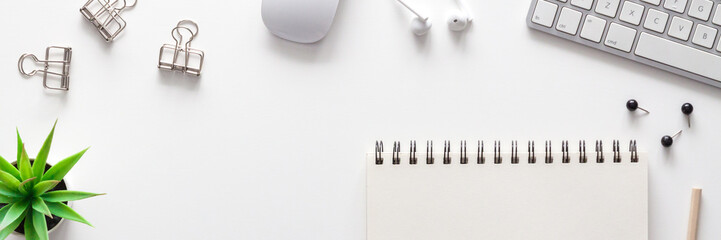 Home office desk with empty copy space and sketchbook mockup. Office supplies. Panorama