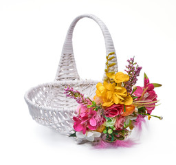 Easter basket from a flower arrangement on white background
