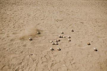 Petanque ball boules and small jack on petanque field