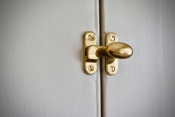 Brass cupboard latch on old english cupboard