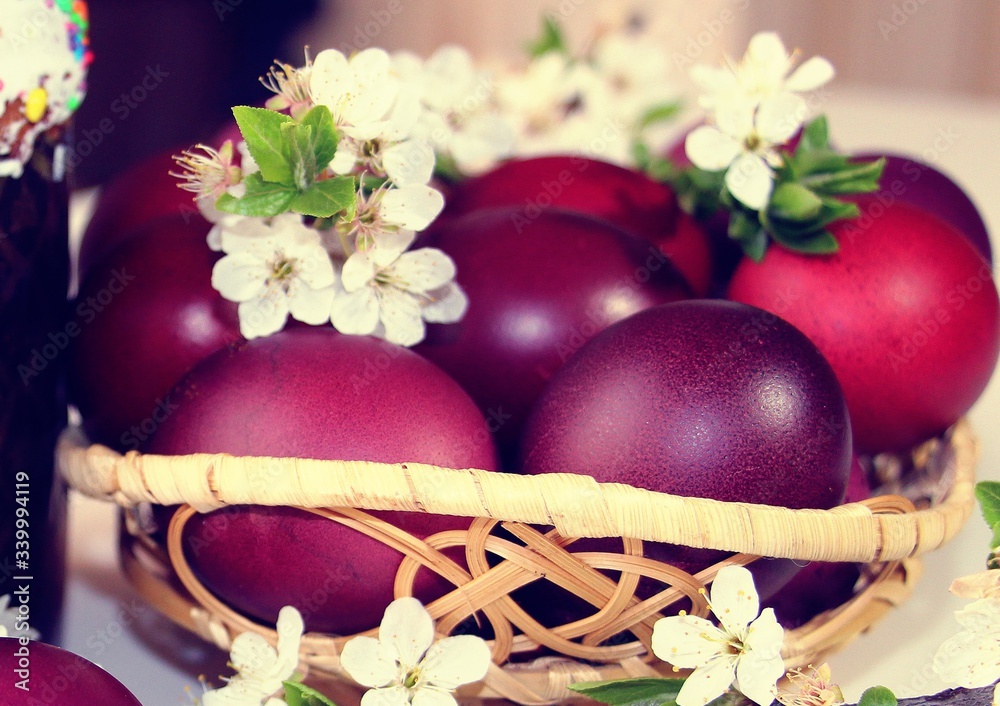 Wall mural Painted red and purple eggs for Easter.