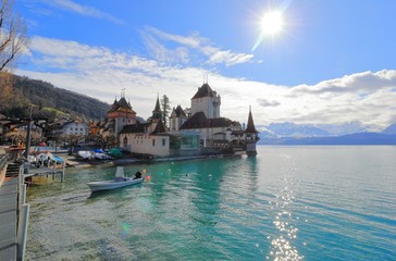 Fototapeta premium Oberhofen Castle from Lake Thun. Oberhofen town is located on the northern shore of Lake Thun. Switzerland, Europe.