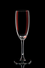 
Glass goblet with red highlights on a black background