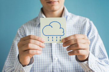 drawing rain cloud icon in the hand