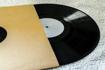 Twelve inch vinyl black record in sleeve
