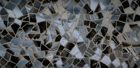 gray, black, transparent, silver mosaic of fragments of stone for decorative design of walls