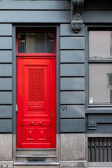 gray facade with red door