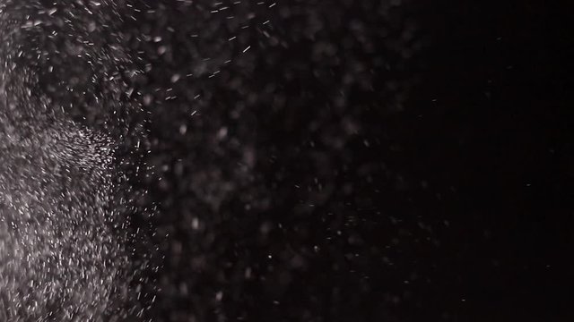 An explosion of white flour. Clouds of white dust. A gust of cold snow storm.