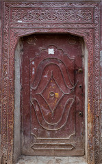 Old carved wooden door with decorative molding, Marrakech, Morocco