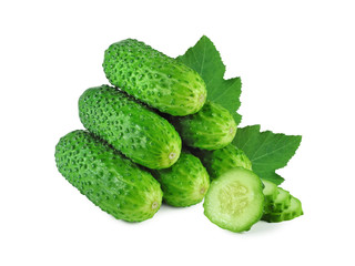 Stack of fresh cucumbers with pimples and juicy slices ​​isolated on white background