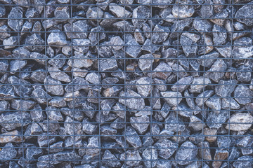 fencing made of stone and iron grating