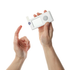 Female checking blood sugar level, isolated on white background